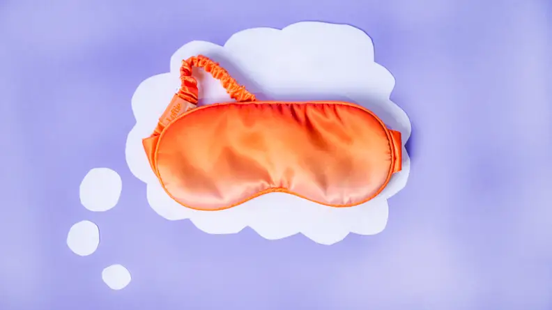 Orange loftie mask on a purple background.