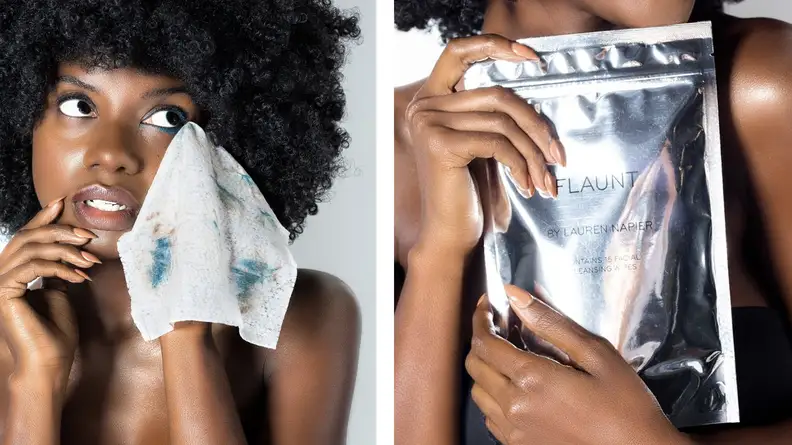 A woman holds and uses facial wipes