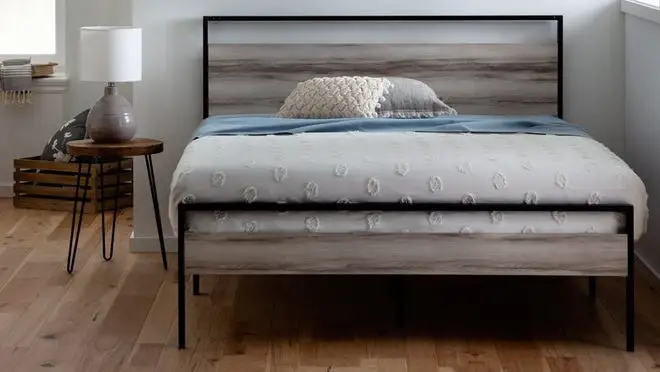 Modern wooden platform bed in modern-styled bedroom.