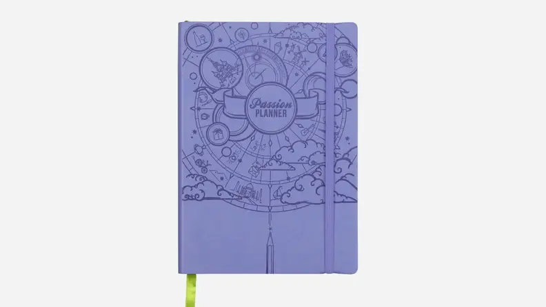 A purple Passion Planner agenda book against a white background.