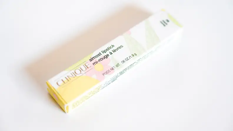 A light colored rectangle lipstick box.