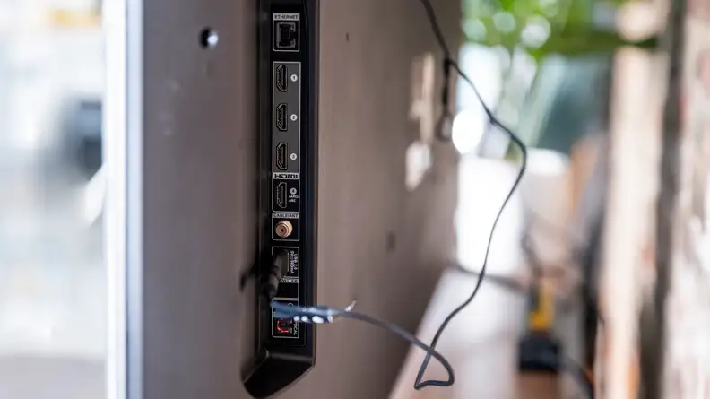 A close-up of the connectivity inputs on the back of the Fire TV Omni's panel