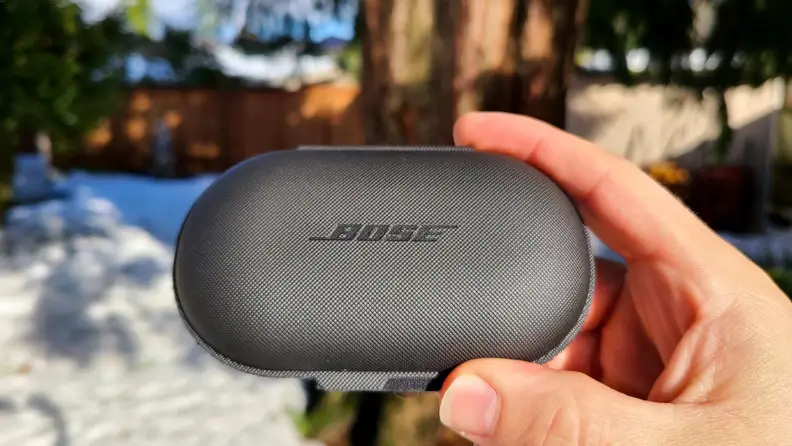 Bose Sport Open Earbuds rubberized case in hand