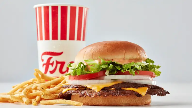 A Freddy's California-style burger with fries and a drink