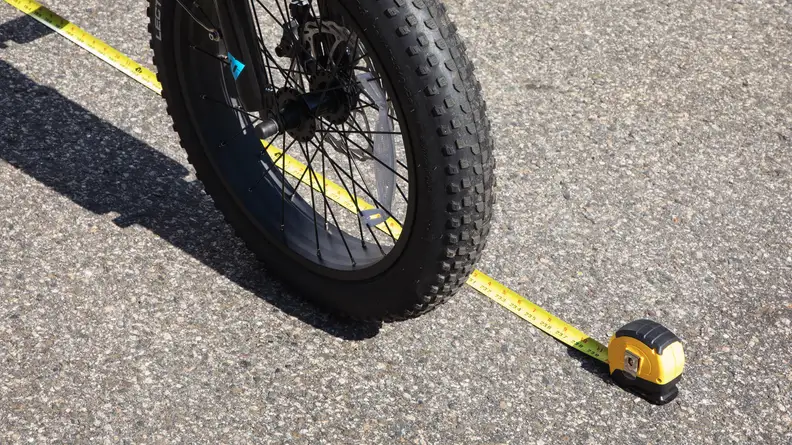 Using a tape measure to record the stopping distance of the Lectric XP 3.0
