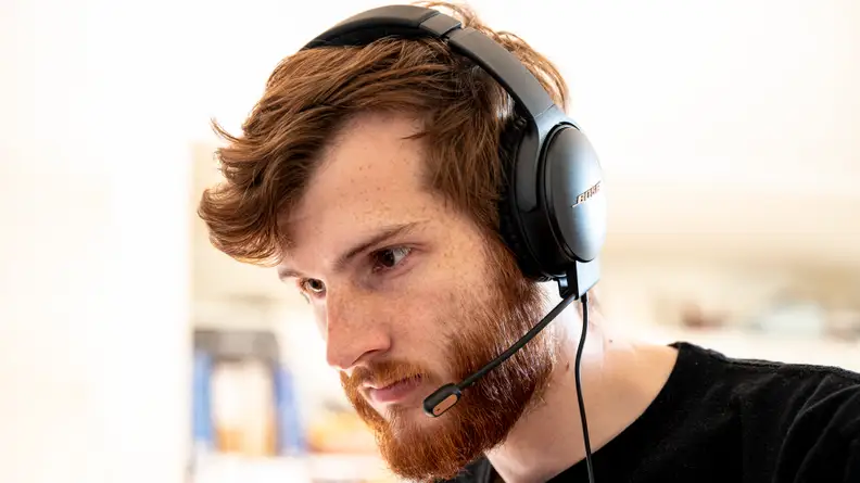 A man wearing a gaming headset