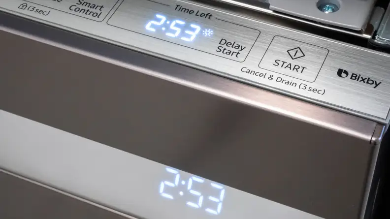 The Samsung DW80R9950UT/AA dishwasher has a top-facing control panel with a clean, intuitive layout.