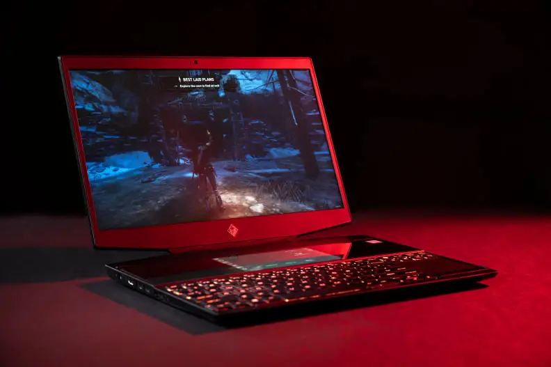 A laptop is in ominous red lighting