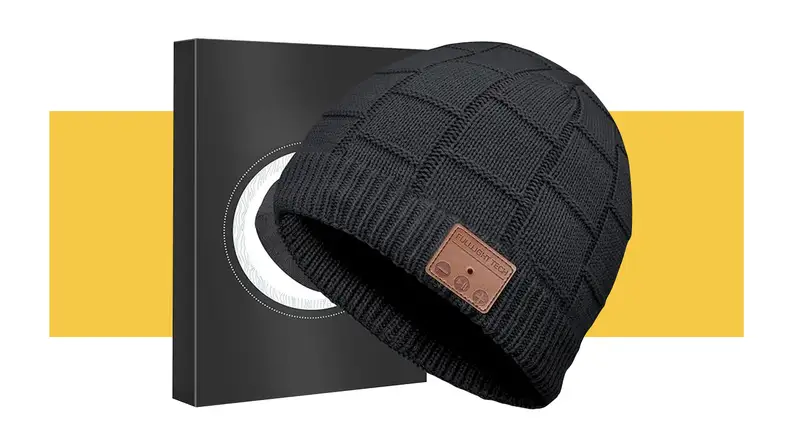 A black FullLight Tech Headphone Beanie against a yellow background