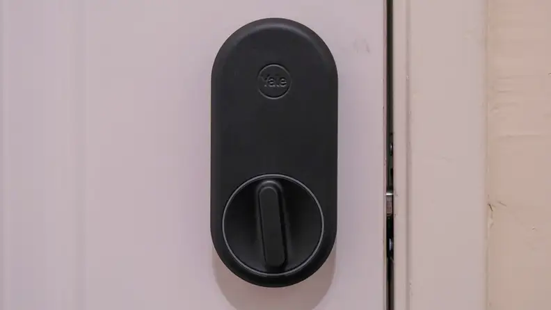 The Yale Approach smart lock mounted to a white door