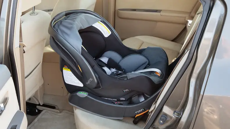 A Chicco KeyFit35 installed in the backseat of a car.