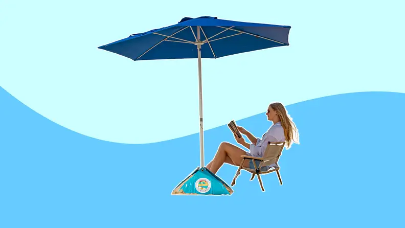 Woman relaxing under beachBUB umbrella on colored background