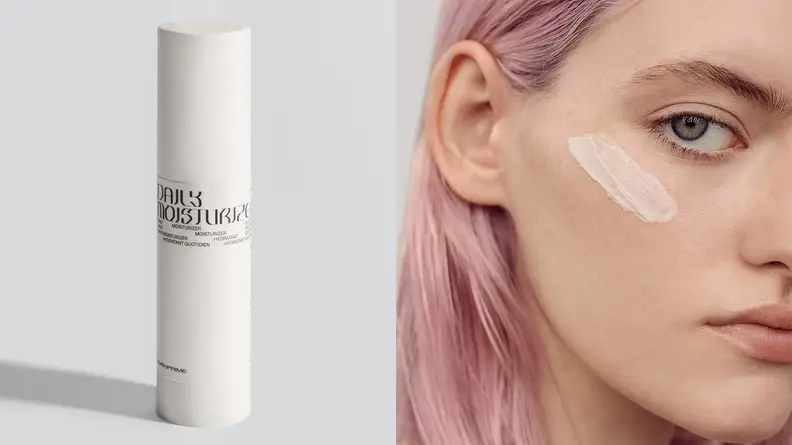 A young model with pink hair has applied Evenprime Daily Moisturizer to their cheek.