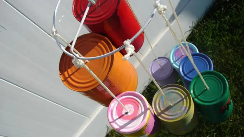 A painted tin can wind chime