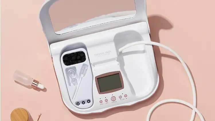 microdermabrasion kit on pink background