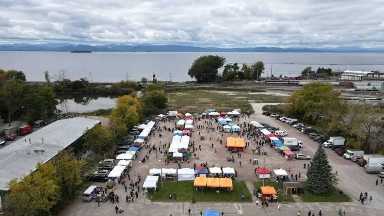 Aerial view of market tents by the lakeshore