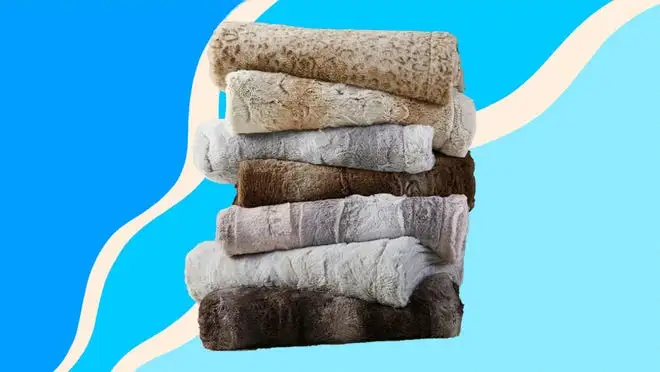 A stack of towels against a blue background.