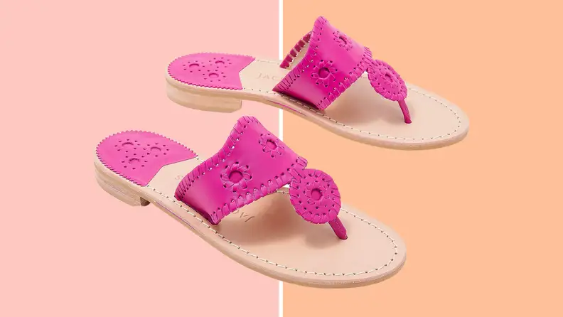 Hot pink Jack Rodgers sandals on a pink and orange backround