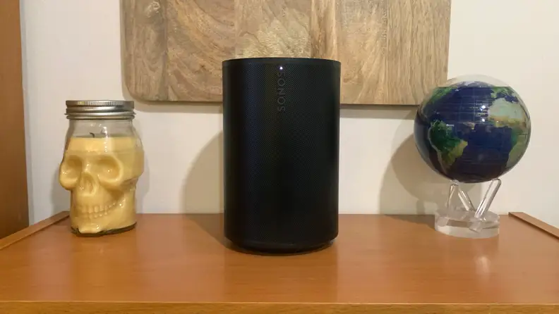 The black Sonos Era 100 on a table.