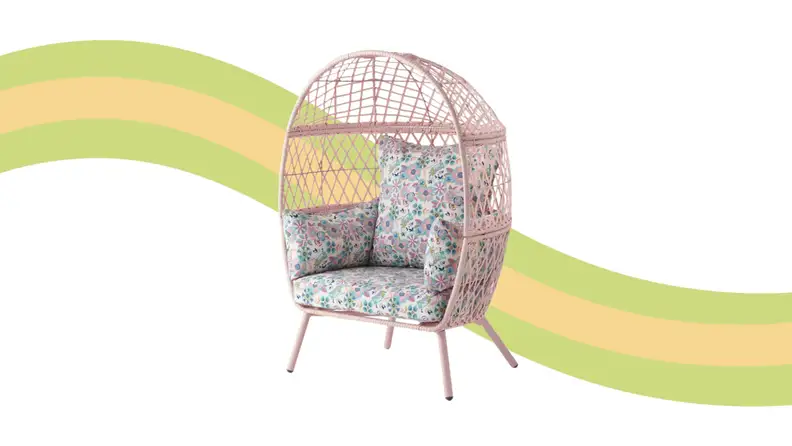 An egg chair against a striped background.