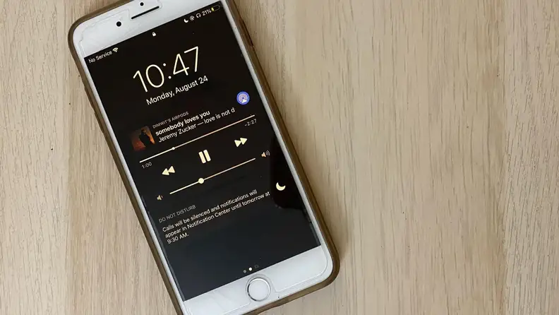 an iphone with do not disturb on a table