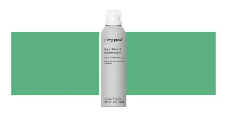 Living Proof. hair product on a green background.