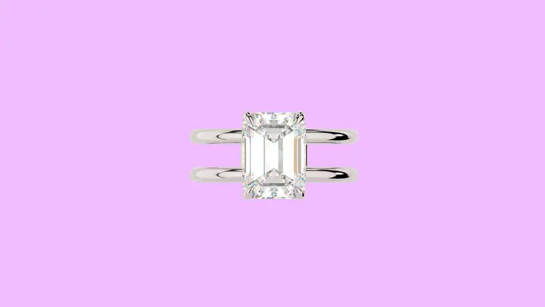 Photo of the East West Gem Co. The Lennon Ring against a purple background.