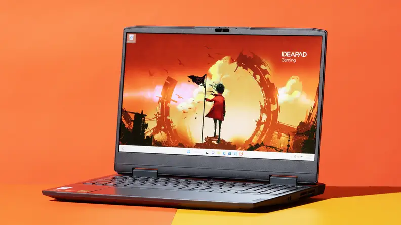 The Lenovo IdeaPad Gaming 3 on an orange background.