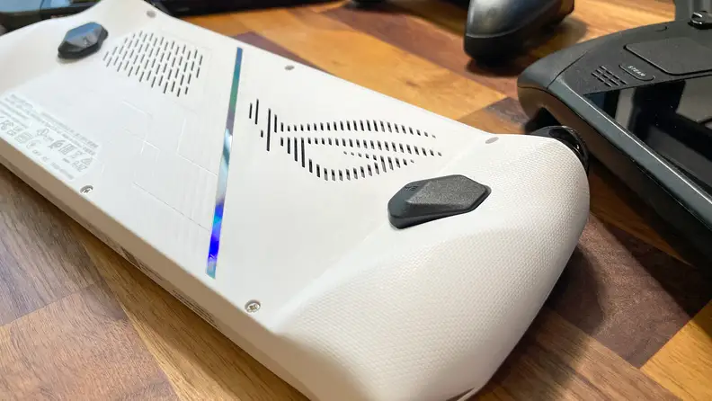 The rear side of a white handheld console