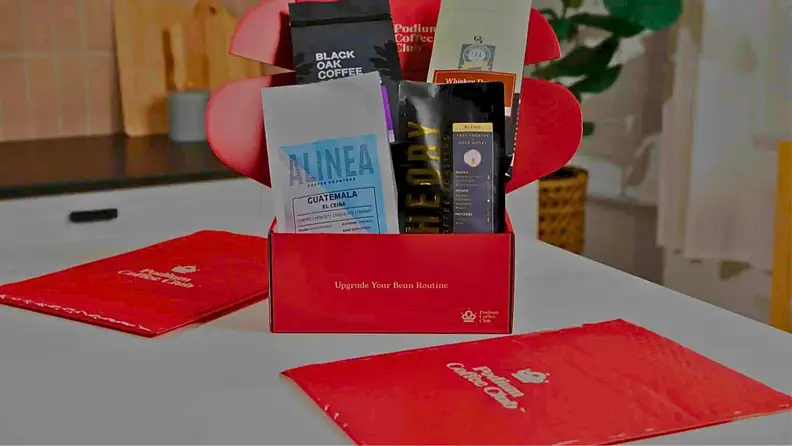 Red Podium Coffee Club box filled with assorted coffee bags