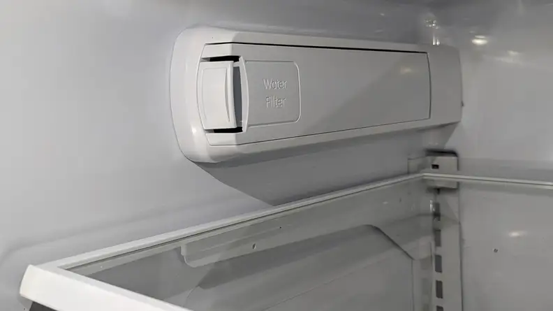 A cl0se-up of the fridge's water filter, located on its left wall.