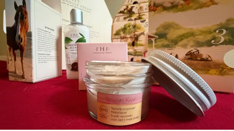 and open jar of heel cream in front of an advent calendar