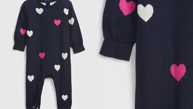 Children's navy one-piece set with pink and white printed hearts.