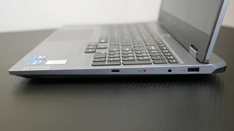 A side shot of a silver gaming laptop, the Lenovo Loq.