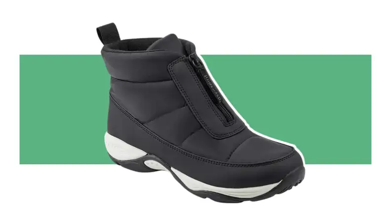 A single black Easy Spirit Edele Cold Weather Casual Booty displayed in front of a green stripe background.