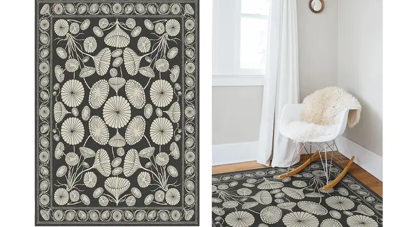 Two images of a black and white rug with a botanical design