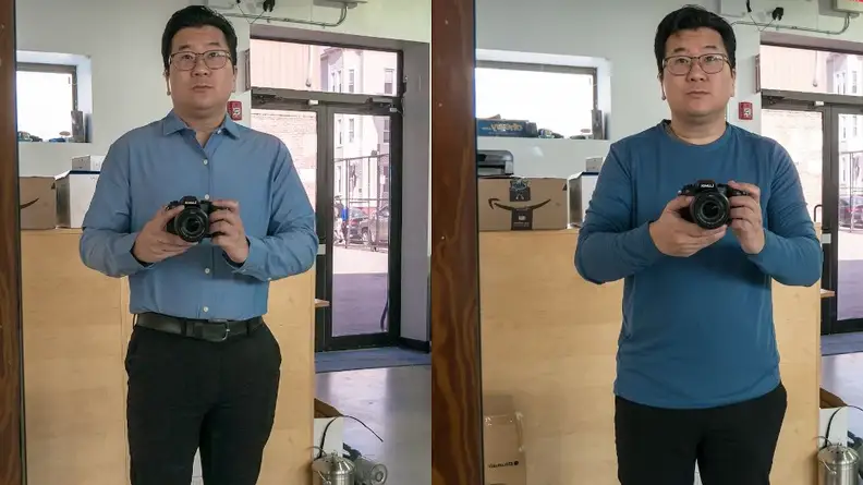 Man wearing blue shirt and black pants.