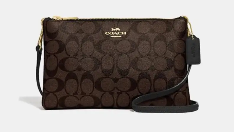A black leather Coach cross body bag.