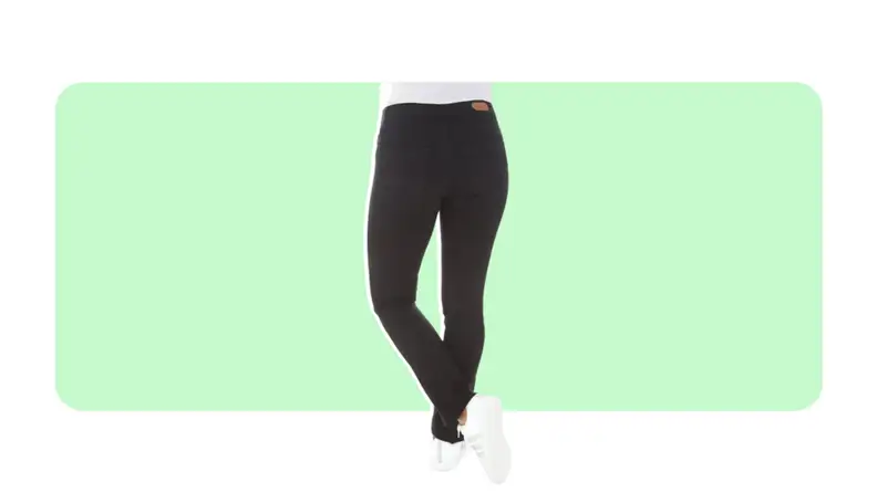 A pair of skinny dark jeans worn with white sneakers.