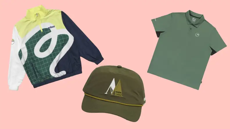 A printed windbreaker, a green baseball cap, and a green polo shirt.