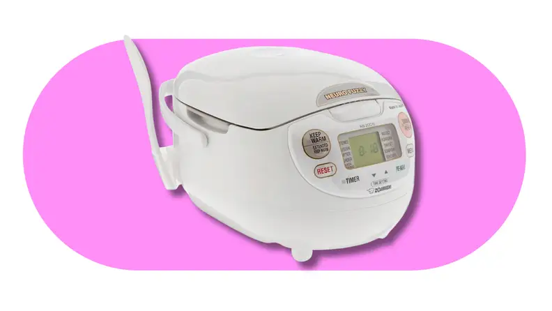 White Zojirushi rice cooker on a pink background