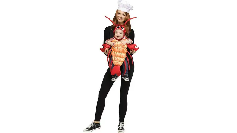 A parent and child dressed as a chef and lobster.