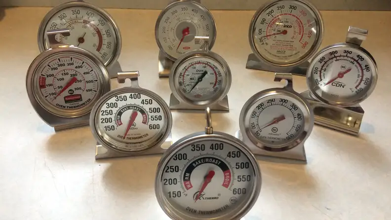 Nine of the best oven thermometers sit on a counter.