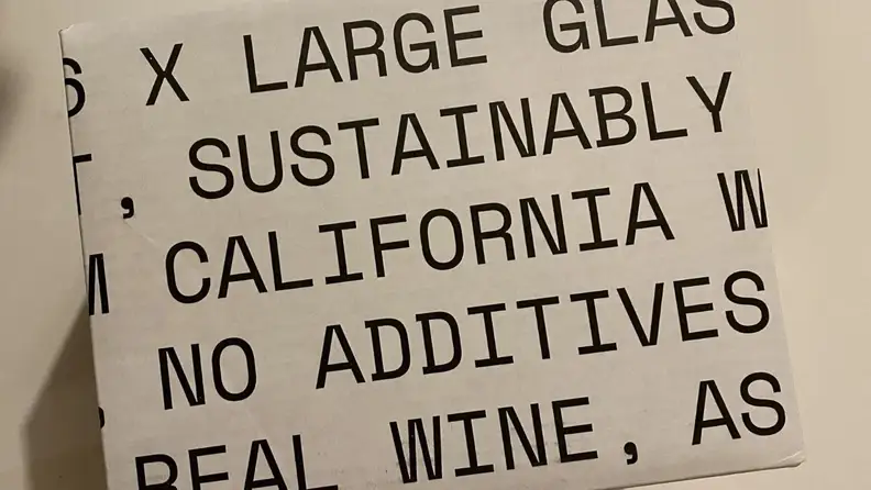 Usual Wines packaging, which features largely printed words about the product.