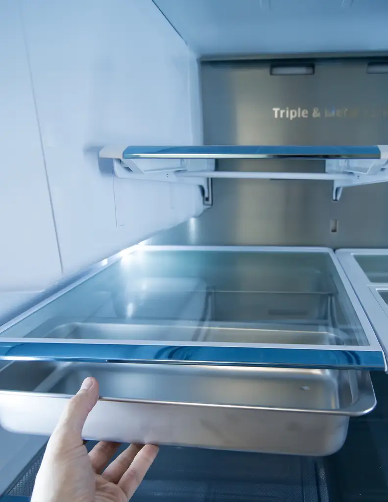 Twin chef pans are kept underneath one of the adjustable shelves.