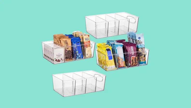 Four ClearSpace pantry organizers arrayed on a teal background, with the two in the center filled with snacks such as raisins, brownies, wafers, nuts, and fig bars.