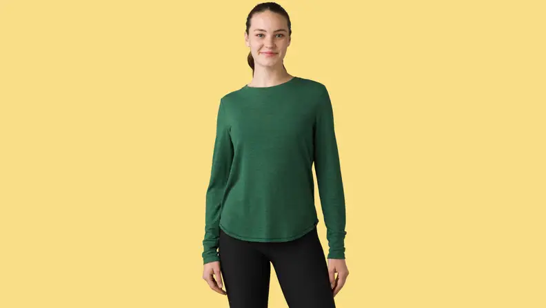 A model showing a green Prana shirt.
