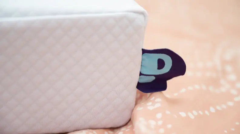 the pillow cube tag on an orange background