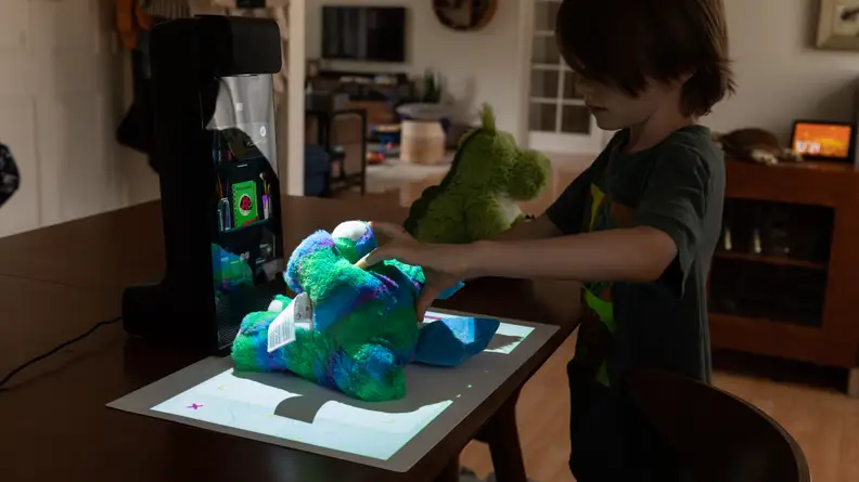 A child plays with their Amazon Glow