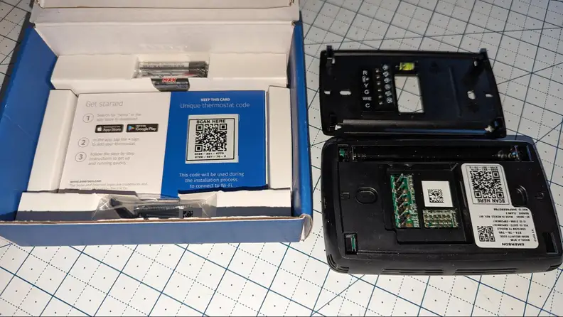 The image shows the Sensi packaging as well as the physical thermostat and installation plate.